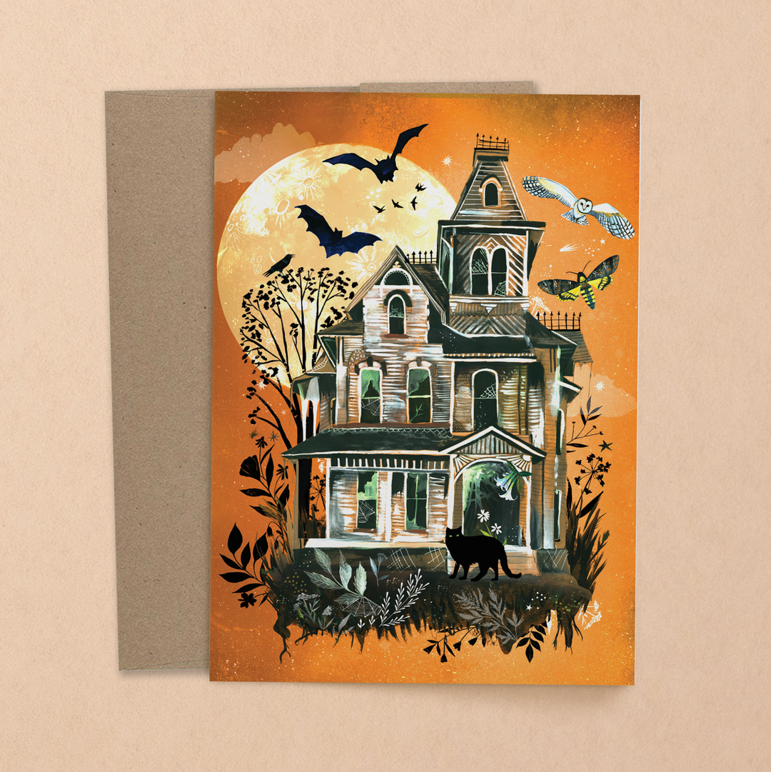 Illustrated Halloween card featuring a haunted house under a full moon. Bats, owls, and a black cat surround the eerie house, with an orange background creating a spooky atmosphere.